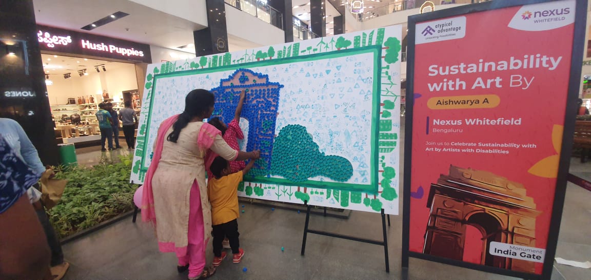 Visitors at Nexus Bangalore joined hands to co-create a vibrant piece of sustainable art using bottle caps transforming everyday waste into a powerful symbol of creativity, collaboration, and conscious living.